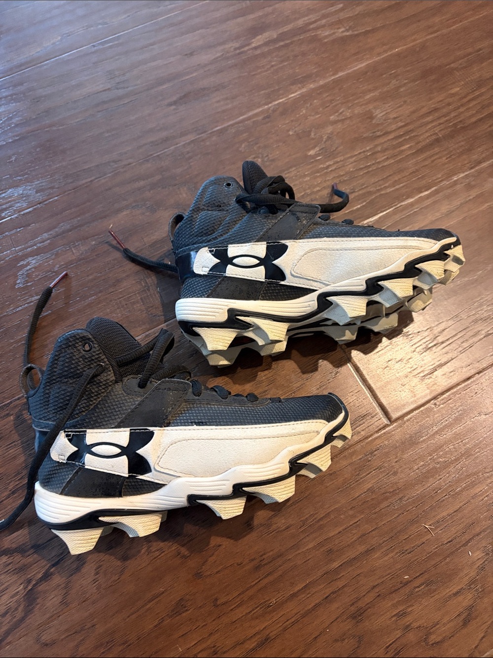 Under Armour Kids' Black and White Athletic Cleats